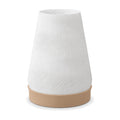 Abajur de mesa com cúpula branca cônica texturizada em ondas e base capuccino, em fundo branco