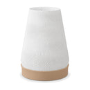 Abajur de mesa com cúpula branca cônica texturizada em ondas e base capuccino, em fundo branco